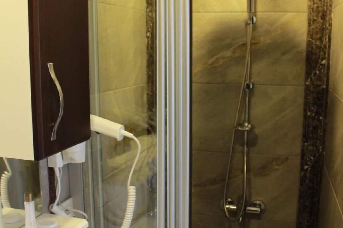 Bathroom | Shower, hair dryer, slippers, towels