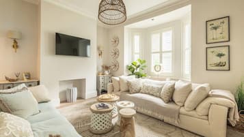 TV, fireplace, books