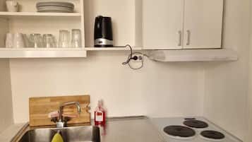 Departamento | Cocina privada | Refrigerador, microondas, horno y parrilla de estufa