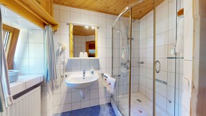 Comfort Apartment | Bathroom | Shower, hair dryer, slippers, towels