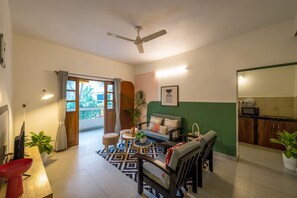 Deluxe Apartment | Living area | Flat-screen TV - Olive Hotel Calangute Niwasa by Embassy Group (Calangute)