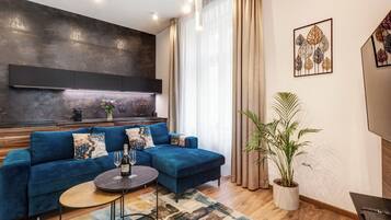 Classic Apartment | Living area | 55-inch Smart TV with satellite channels, pay movies