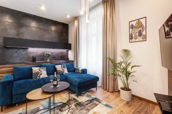 Classic Apartment | Living area | 55-inch Smart TV with satellite channels, pay movies