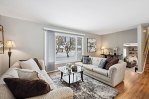 House, 4 Bedrooms, Patio | Living room | Books - Minne-getaway, Designer Stay South Of The River (Apple Valley)