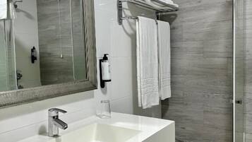 Shower, rainfall showerhead, hair dryer, towels