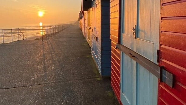 A coastal building with a long corridor leading to a beach. - 4 Hilbre - Seaside Retreat Sheringham  (Sheringham,)