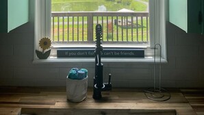 A kitchen with a large window overlooking a green landscape. - William's Catch at Racoon Springs - 16+ Guests (Marshall)