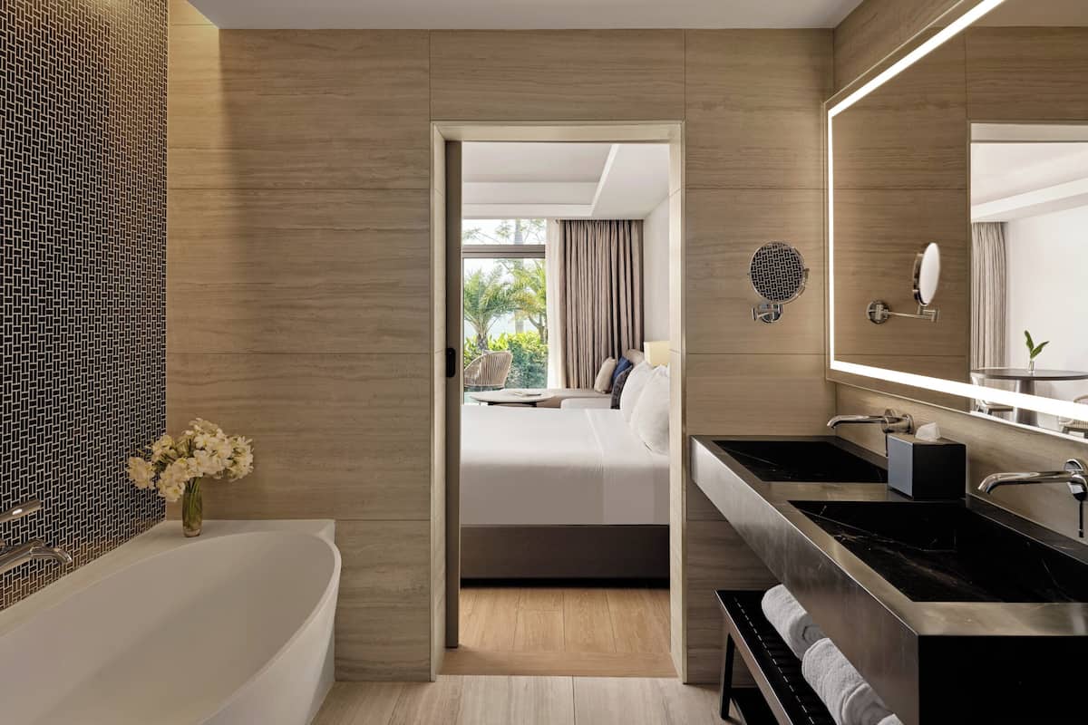 combined shower/bathtub, bathrobes, slippers, towels