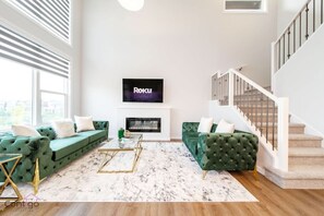 Smart TV, fireplace, books, offices