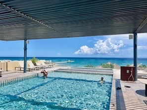 Outdoor pool, pool umbrellas - Centric condo by Casago (Playa del Carmen)