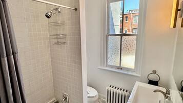 Shower, hair dryer, towels, soap