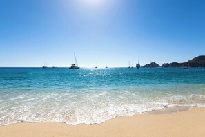 On the beach, sun loungers, beach towels