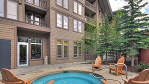 A building with a pool and outdoor seating. - A Skiers Paradise, Short Walk to Lift. TX202 (Copper Mountain)