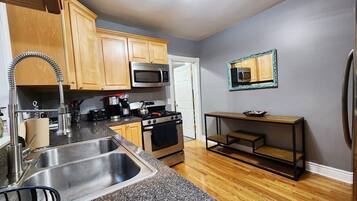 Microwave, dishwasher, dining tables