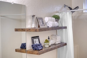 Combined shower/tub, hair dryer, towels, soap