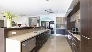 Fridge, coffee/tea maker, high chair, cookware/dishes/utensils