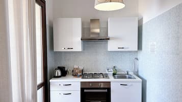 Premium Apartment | Private kitchen | Full-sized fridge, oven, stovetop, coffee/tea maker