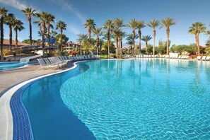 A large, clear swimming pool with lounge chairs and palm trees. - MARRIOTT'S SHADOW RIDGE VILLAGES - STUDIO - PREMIER HOST- RESORT ACCESS (Palm Desert)