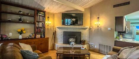 Smart TV, fireplace, books