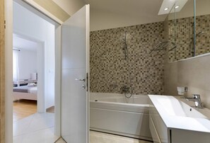 Bathtub, hair dryer, bidet, towels