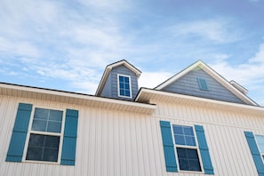 A building with a gabled roof and a dormer window.