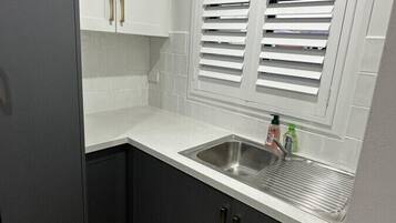 Coffee/tea maker, fridge, microwave, oven