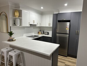 Coffee/tea maker, fridge, microwave, oven