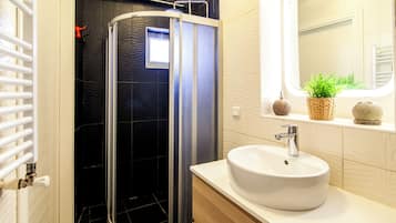 City House | Bathroom | Shower, rainfall showerhead, hair dryer, towels