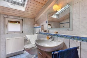 Bathtub, hair dryer, towels