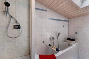 Bathtub, hair dryer, towels