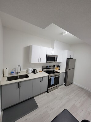Fridge, microwave, oven, stovetop - Stay in Style - Guest Suite - 2bedroom/2bath in Windermere Community  (Edmonton)