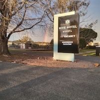 A sign for the Hive Hotel in Moruya with a message indicating no vacancy and mentioning conference facilities.