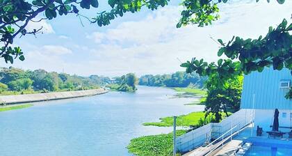 A slice of paradise with a beautiful river view and infinity pool.