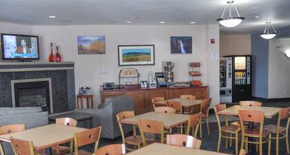 Hotel room with ONE QUEEN BED and attached, private bathroom.