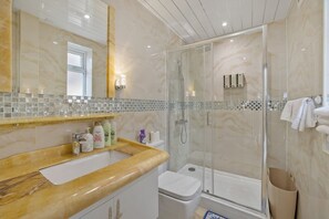 Hair dryer, towels, soap, shampoo