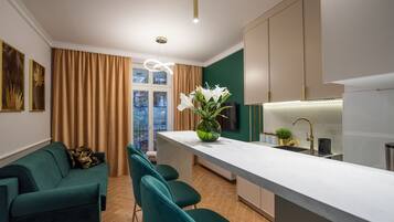 Comfort Apartment | Private kitchen | Fridge, stovetop, electric kettle, cookware/dishes/utensils