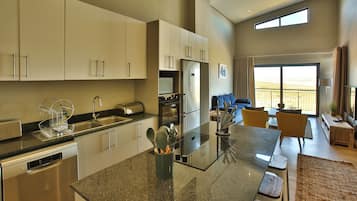 Elite Apartment | Living area | 42-inch flat-screen TV with satellite channels