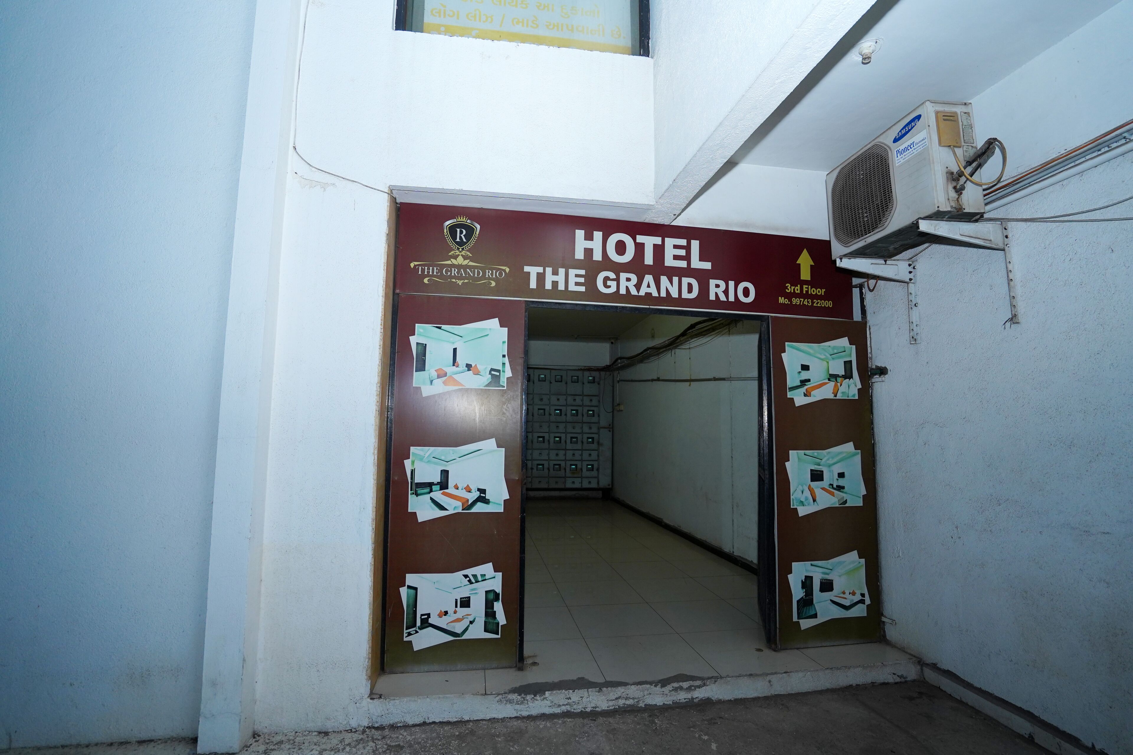 An entrance to Hotel The Grand Rio with a sign indicating the 3rd floor.
