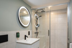 Shower, rainfall showerhead, designer toiletries, hair dryer