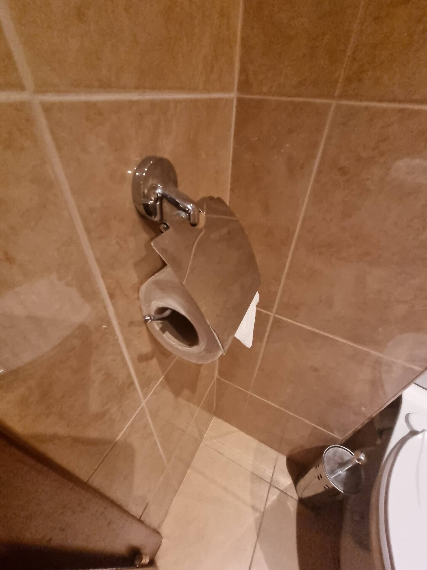 A bathroom with a toilet, a bidet, and a sink.