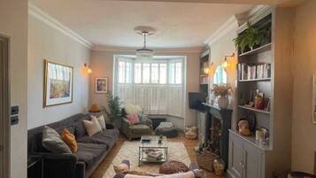 Basic House, Multiple Beds | Living area | TV
