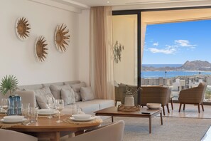 Family Apartment | Living area | 50-inch flat-screen TV with digital channels
