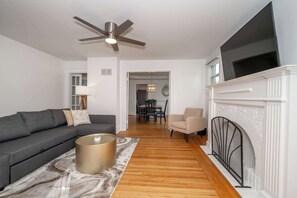 House, Multiple Beds, Balcony, Garden View | Living area | TV, fireplace - Devou Park Cottages (Covington)