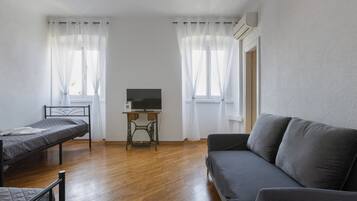 Panoramic Apartment | Living area | 30-inch Smart TV with digital channels, Netflix, streaming services
