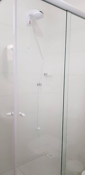 Shower, hair dryer, towels, toilet paper