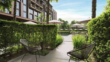 Deluxe Room, 2 Double Beds, Garden View | 1 bedroom, blackout curtains, soundproofing, free cots/infant beds