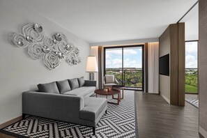 Signature Suite, 1 Bedroom, Corner | Living room | 55-inch Smart TV with cable channels