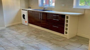 House, Multiple Beds | Private kitchen | Fridge, microwave, oven, stovetop