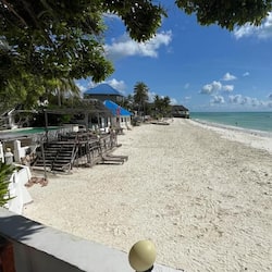 On the beach, white sand, sun loungers, beach massages