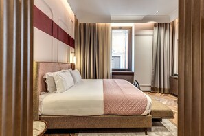 A hotel room with a large bed, a bedside table, a window with curtains, and a view of the outside. - THE STEPS Hotel - by Eitch Collection (Rome)